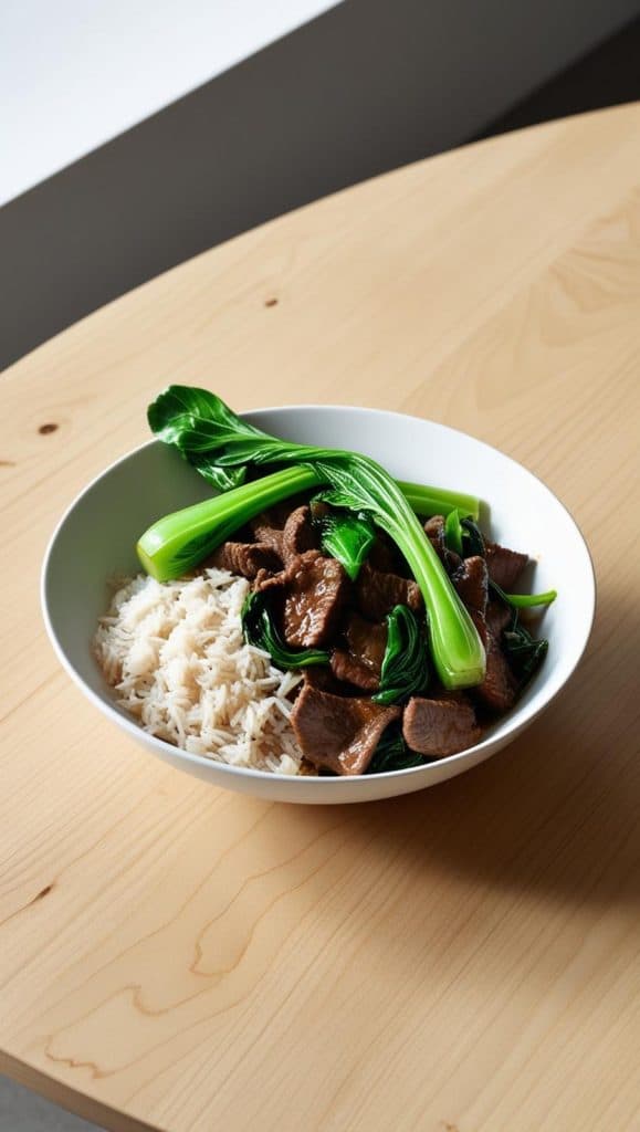 Beef Stir Fry with Bok Choy and Jasmine Rice in a white bowl on modern table
